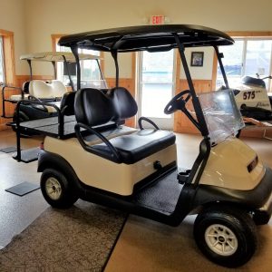 Beige and black 4 passenger electric golf cart